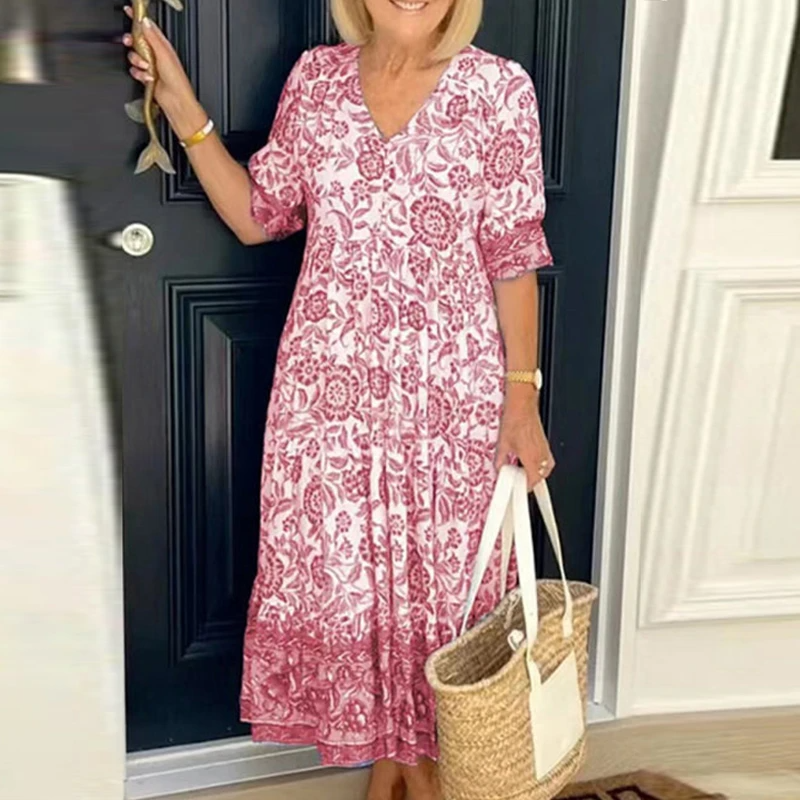 Stepānija - Bohemian dress with V-shaped neckline and floral pattern