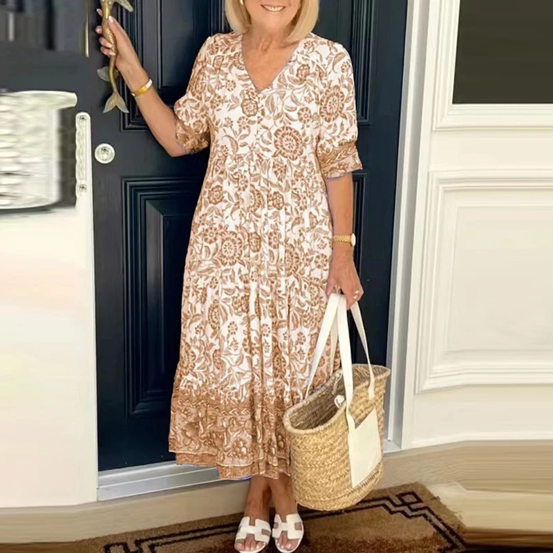 Stepānija - Bohemian dress with V-shaped neckline and floral pattern