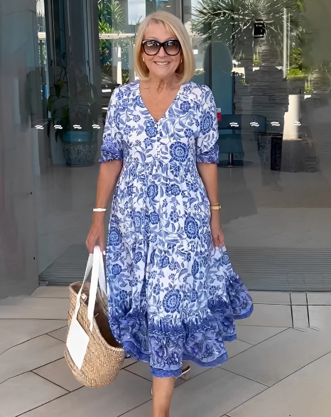 Stepānija - Bohemian dress with V-shaped neckline and floral pattern